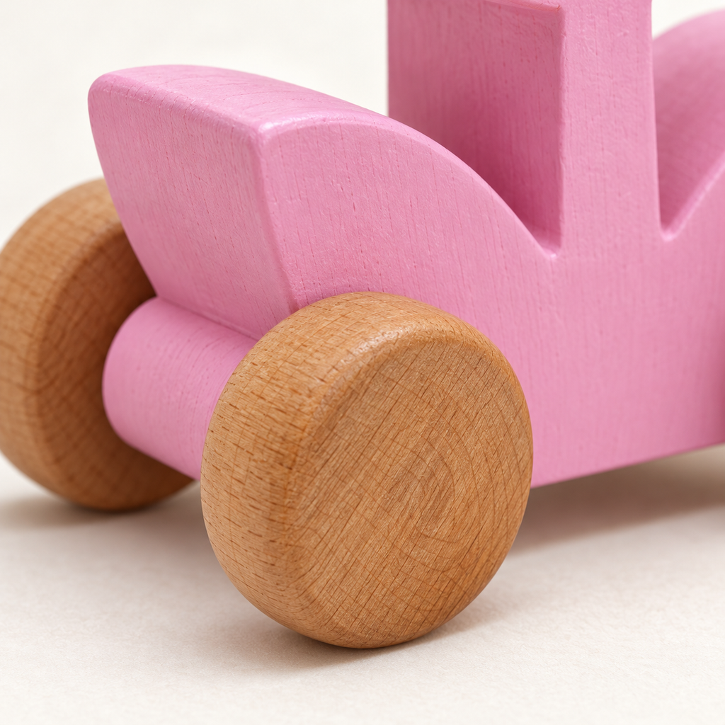 Pink Tulip Wooden Car — close-up of wooden wheel and painted finish
